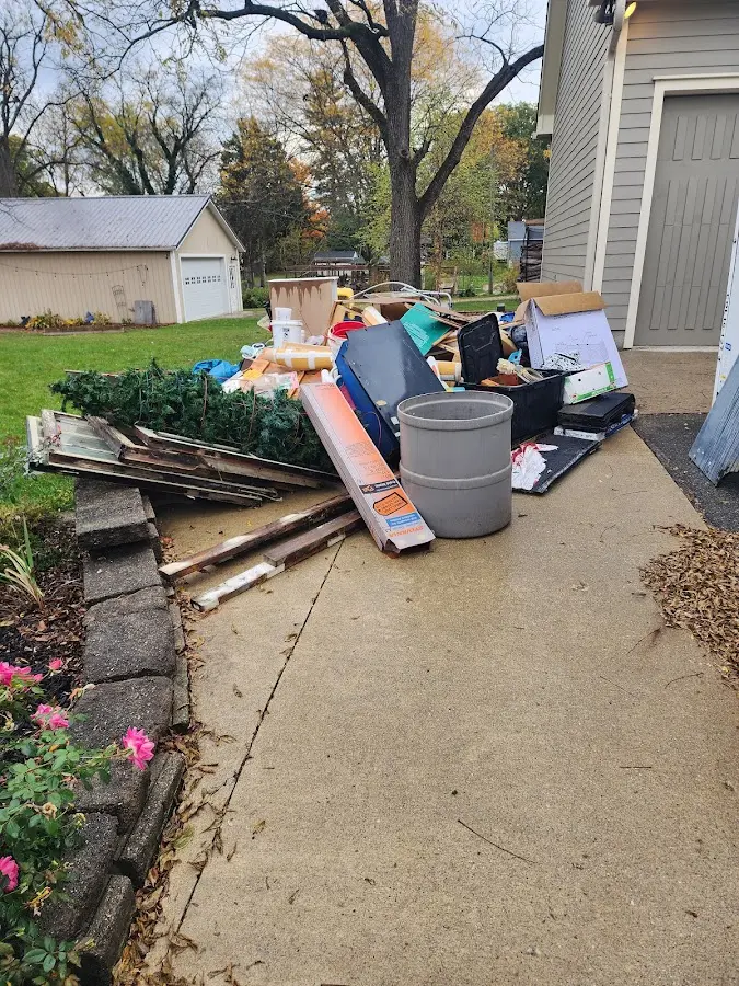 Dumpster being loaded with debris for Roofing Dumpster Rental in Alameda